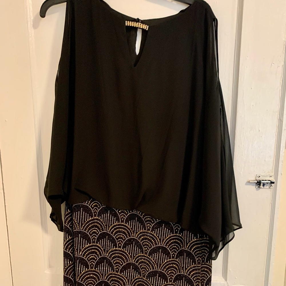 Black with silver/gold design on the bottom. Size 18.